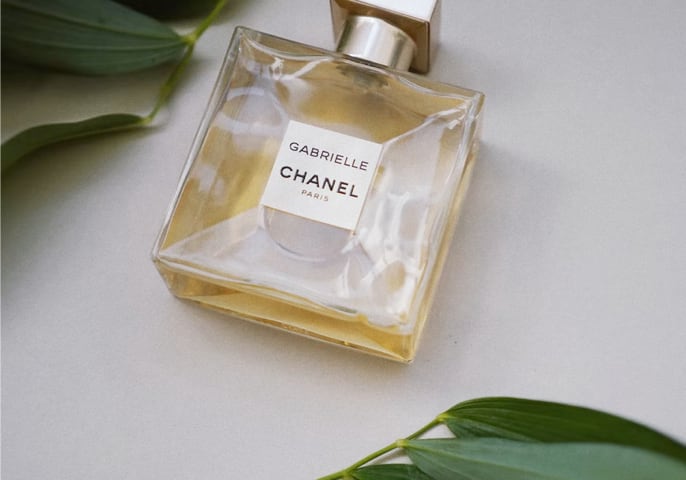 image of a perfume with a grey background